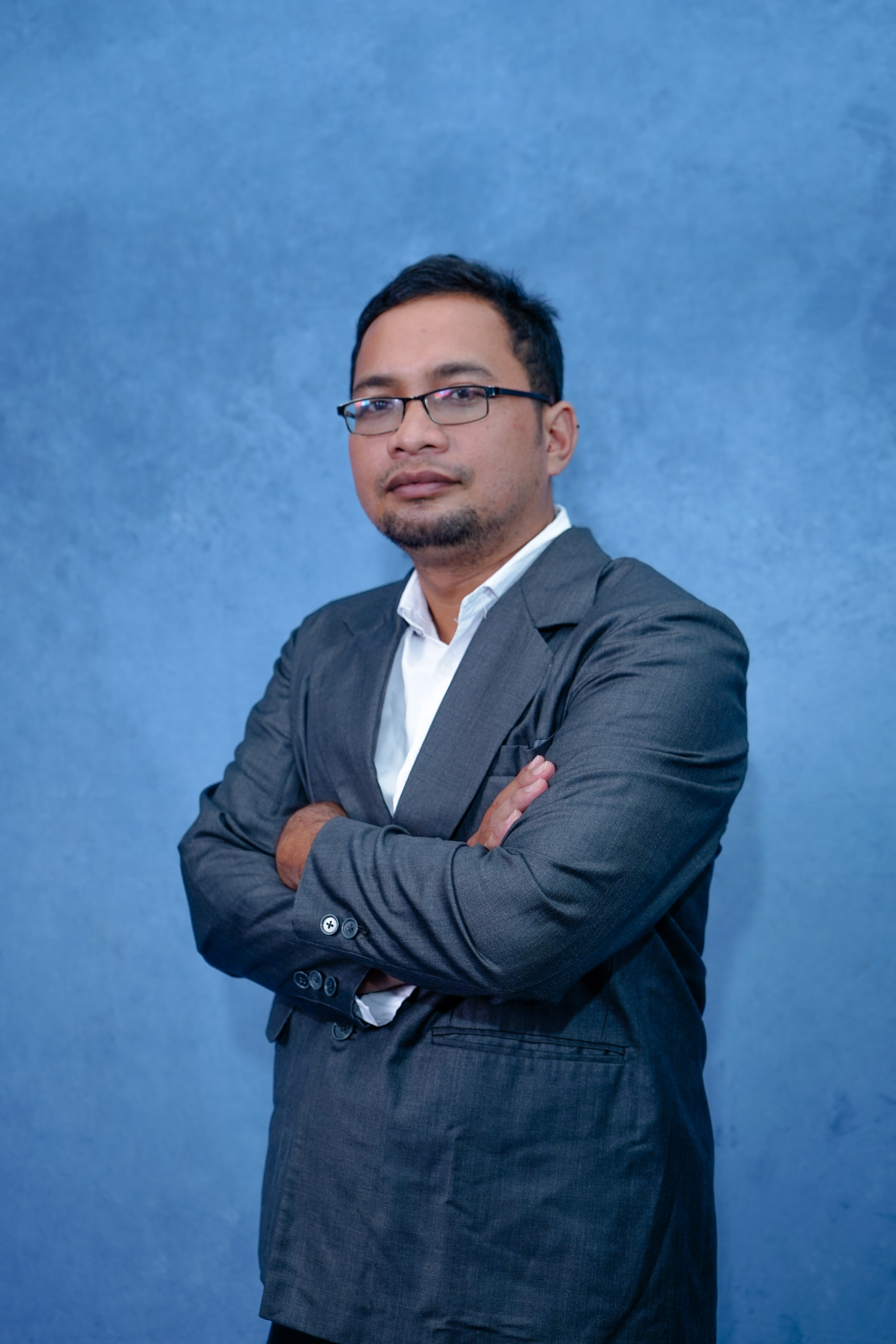 Professional headshot of Anna Garcia, mobile app developer with smartphone and laptop, confident pose, modern office environment, tech-savvy appearance