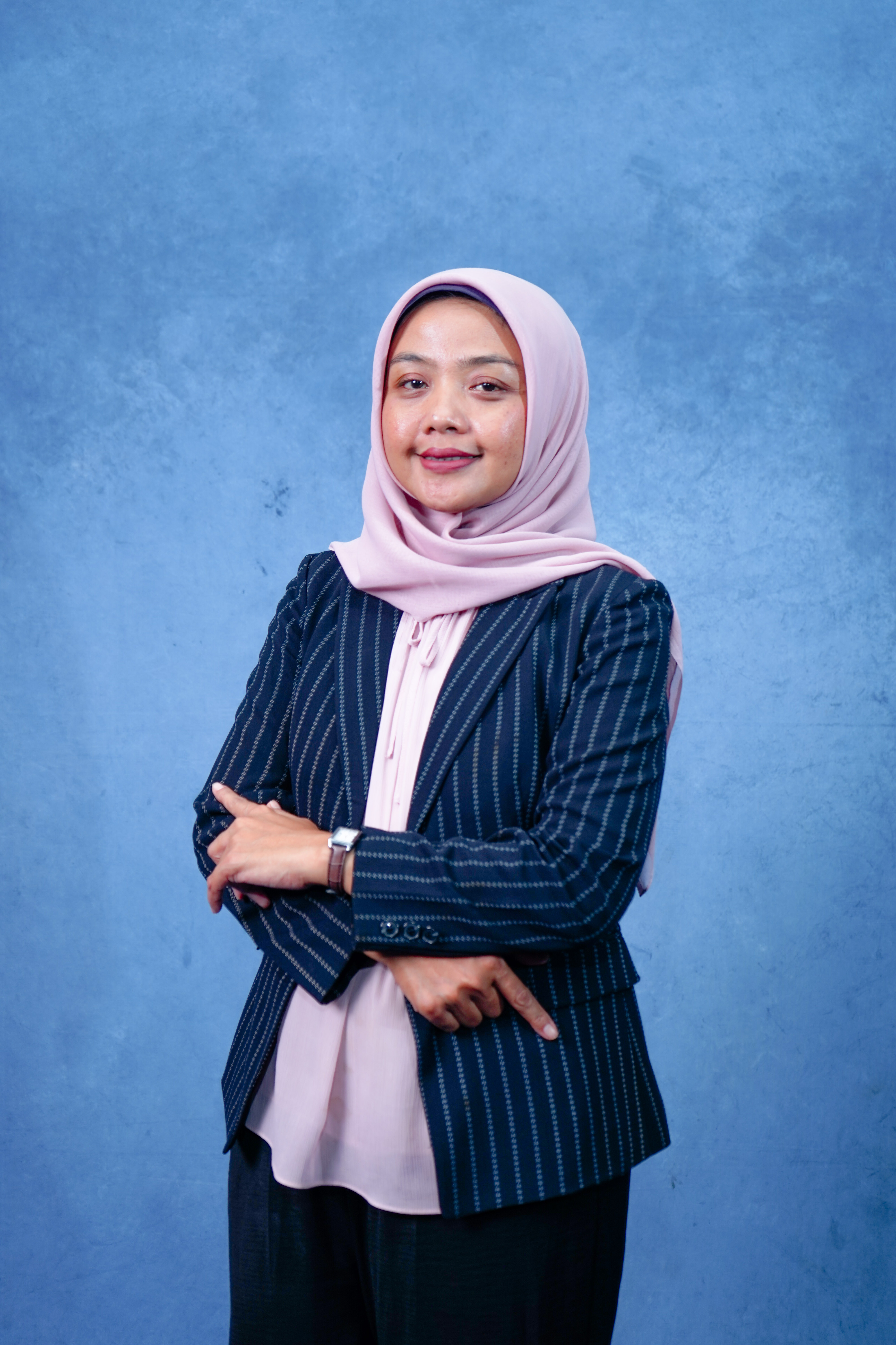 Professional headshot of Anna Garcia, mobile app developer with smartphone and laptop, confident pose, modern office environment, tech-savvy appearance