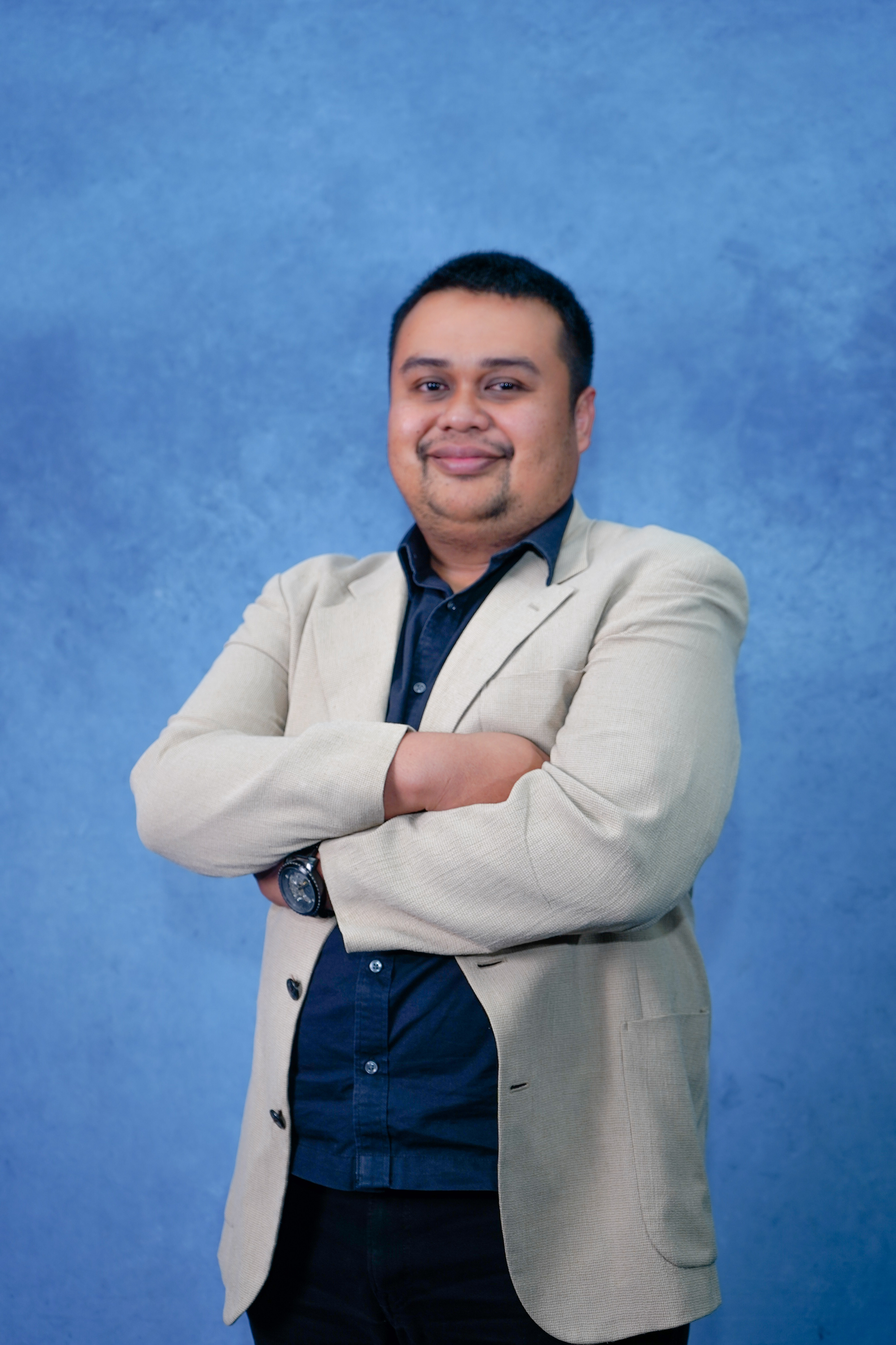 Professional headshot of Anna Garcia, mobile app developer with smartphone and laptop, confident pose, modern office environment, tech-savvy appearance